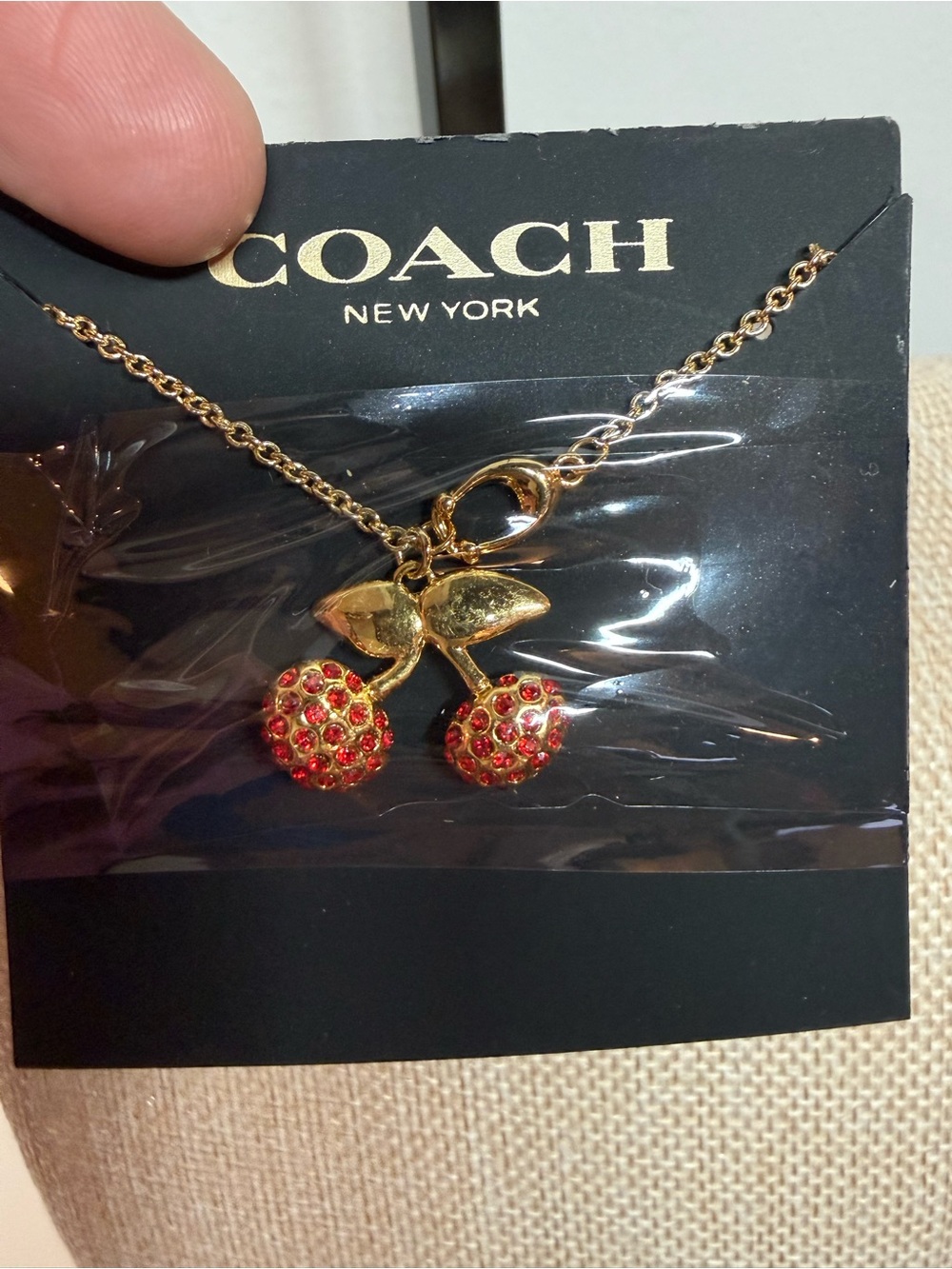 COACH Gold-Tone Cherry Pendant Necklace with Red Crystal cherries